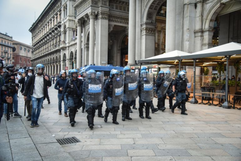 epa_6ad7a7b2b44d-1792518066 epa13314004 Italian police officers in riot gear patrol near Piazza del Duomo in Milan, Italy, 18 October 2026. Clashes between protesters and police broke out during a demonstration against the rising cost of living on 17 October, followed by further disturbances in the city center on 18 October. EPA/MATTEO CORNER