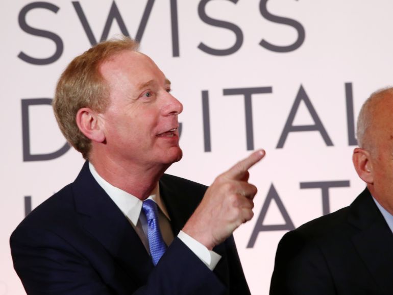 f7b9082e-02f9-4d18-8c47-7ed76725cfa3 Microsoft Chairman Brad Smith and Swiss President Ueli Maurer wait for a news conference after the Swiss Global Digital Summit in Geneva, Switzerland, September 2, 2019. REUTERS/Denis Balibouse