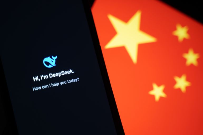 getty_6a32d64b98-1781716555 HONG KONG, CHINA - JANUARY 28: In this photo illustration, the DeepSeek apps is seen on a phone in front of a flag of China on January 28, 2025 in Hong Kong, China. Global tech stocks have plummeted following the emergence of DeepSeek, a Chinese AI startup that has developed a competitive AI model at a fraction of the cost of its US rivals, sparking concerns about the high valuations of tech giants like Nvidia. This development has led to significant declines in tech shares across Asia and Europe, with markets in both regions experiencing notable losses as investors reassess the AI landscape and its potential impact on the industry's future. (Photo illustration by Anthony Kwan/Getty Images)