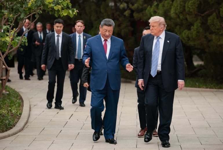 BEIJING, CHINA - MAY 15: U.S. President Donald Trump walks with Chinese President Xi Jinping while leaving after a visit to Zhongnanhai Garden on May 15, 2026 in Beijing, China. Trump and other U.S. officials are finishing up a visit intended to address the Iran conflict, trade imbalances, and the Taiwan situation while establishing new bilateral boards for economic and AI oversight. (Photo by Evan Vucci - Pool/Getty Images)