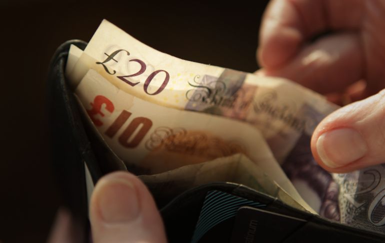 getty_6a60c1f17d-1784726001 LONDON, ENGLAND - FEBRUARY 17: In this photo illustration bank notes are shown with a wallet on February 17, 2010 in London, England. As the UK gears up for one of the most hotly contested general elections in recent history it is expected that the economy, immigration, the NHS and education are likely to form the basis of many of the debates. (Photo by Peter Macdiarmid/Getty Images)