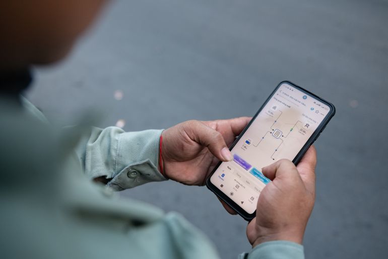 getty_6ac20a7d91-1791101565 HO CHI MINH CITY, VIETNAM - MAY 13: A man checks a rooftop solar monitoring app on his phone on May 13, 2026 in Ho Chi Minh City, Vietnam. Vietnam is expanding rooftop solar adoption as part of a broader push toward renewable energy and long-term energy security. (Photo by Thanh Hue/Getty Images)