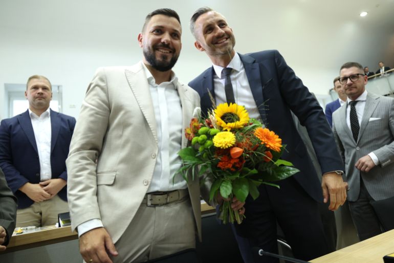 MAGDEBURG, GERMANY - OCTOBER 6: Ulrich Siegmund (R), who recently led the far-right Alternative for Germany (AfD) to victory in state elections in Saxony-Anhalt, poses for a photograph with Tobias Rausch (L), MP of the Alternative for Germany (AfD) as he is elected next Parliamentary President with 48 votes during the parliament's first session since state elections in September on October 6, 2026 in Magdeburg, Germany. The far-right Alternative for Germany (AfD) won the elections by a wide margin. (Photo by Sean Gallup - Pool/Getty Images)