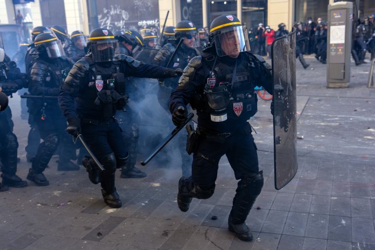 getty_6ad8807cca-1792573564 PARIS, FRANCE - OCTOBER 17: Police officers charge at protesters during demonstrations on October 17, 2026 in Paris, France. The involvement of the Gilets Jaunes (Yellow Vests) with the ongoing French school blockades expands the scope of these demonstrations by linking localised student grievances to broader economic policies. Student unions originally initiated the movement to protest underfunding, deteriorating infrastructure, and acute teacher shortages across French high schools and universities. By joining the protests, the Gilets Jaunes introduce their established platform against austerity cuts, rising living costs, and surging fuel prices into the youth-led action. (Photo by Carl Court/Getty Images)