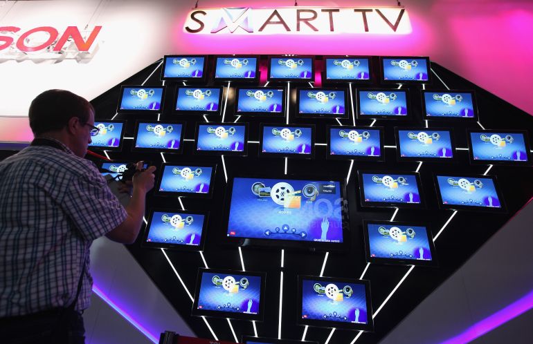 getty_6ad9ff8061-1792671616 BERLIN, GERMANY - SEPTEMBER 02: A visitor looks at a display of Smart TV televisions at the Thomson stand at the IFA 2011 consumer electonics and appliances trade fair on the first day of the fair's official opening on September 2, 2011 in Berlin, Germany. The IFA 2011 will be open to the public from September 2-7. (Photo by Sean Gallup/Getty Images)
