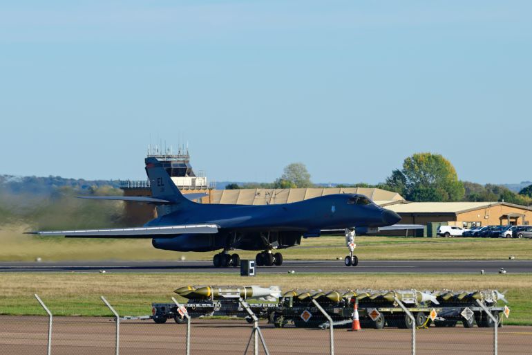 FAIRFORD, ENGLAND - OCTOBER 4: Munitions sit beside runway 27 as a Rockwell B1 Lancer heavy bomber departs for home at RAF Fairford on October 04, 2026 in Fairford, United Kingdom. Around a dozen US B-1B Lancer bombers remain stationed at RAF Fairford in Gloucestershire, following a significant military drawdown late last month that saw six B-52 Stratofortress bombers return across the Atlantic. The heavy aircraft are part of an American forward strike force that has used the Gloucestershire airfield to conduct missions against Iranian capabilities, with total aircraft numbers at the Gloucestershire hub previously peaking between 21 and 23 strategic bombers earlier this year. (Photo by David Bown/Getty Images)