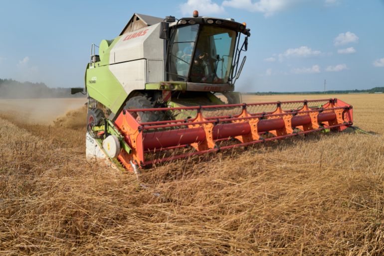 CHERNIHIV, UKRAINE - AUGUST 30: Agricultural workers harvest a large field of barley near the border with Russia in the Chernihiv region on August 30, 2023 in Chernihiv, Ukraine. (Photo by Pierre Crom/Getty Images)