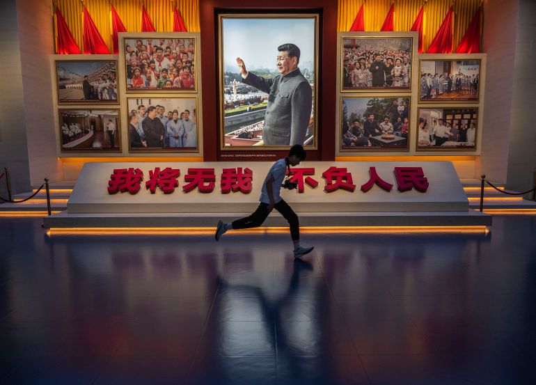 getty_6ae48281e2-1793360513 BEIJING, CHINA - JULY 01: A boy runs by a portrait of Chinese president and party Chairman Xi Jinping, as he visits the Museum of the Communist Party on the 105th anniversary of the founding of the organization in 1921, on July 1, 2026 in Beijing, China. Various events were marked across the country, and at the main event held at the Great Hall of the People, Chinese president and Party Chairman Xi Jinping referred to the party in his speech as the "most magnificent epic" of the Chinese nation. (Photo by Kevin Frayer/Getty Images)