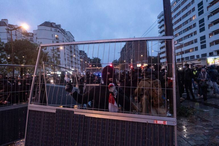 getty_6ae5adda69-1793437146 PARIS, FRANCE - OCTOBER 24: A protester carries a construction fence to build a barricade during a protest on the streets of Paris on October 24, 2026 in Paris, France. Authorities in French cities and towns have imposed curfews, restrictions on movement, and some outright bans on demonstrations planned for October 24, following outbreaks of violence and looting on the fringes of the mostly peaceful protests that took place on October 17. French President Emmanuel Macron called for a ban on all demonstrations that were not organized by trade unions, and urged a return to calm. Nationwide demonstrations in France have gained momentum in recent weeks, sparked by student protests over poor conditions in the education system, and spiraling into overall discontent with the cost of living. (Photo by Manu Brabo/Getty Images)
