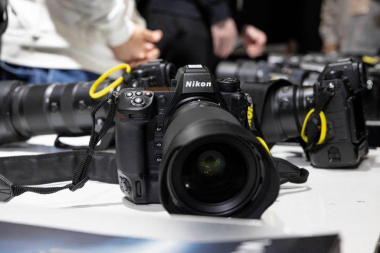 gettyimages-2201778311-1791307315 YOKOHAMA, KANAGAWA, JAPAN - 2025/02/27: Nikon camera prepared for visitors inside the Nikon exhibition area at CP+ 2025 in Pacifico Yokohama. CP+ (Camera & Photo Imaging Show) is an international photography and imaging trade show held annually in Yokohama, Japan, at the Pacifico Yokohama convention center. It is one of the world's largest events dedicated to cameras, photography, and imaging technology, organized by the Camera & Imaging Products Association (CIPA). The show serves as a platform for leading camera manufacturers, lens makers, and imaging-related companiessuch as Canon, Nikon, Sony, Fujifilm, Panasonic, Sigma, and Tamronto showcase their latest products, technologies, and innovations. (Photo by Stanislav Kogiku/SOPA Images/LightRocket via Getty Images)