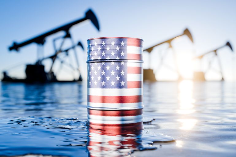 gettyimages-2258151368-1779747834 Barrel of oil depicting the United States of America. Oil production in the United States. The price of oil produced in America. American oil. Black barrels of oil or fuel with the US flag. 3D render.