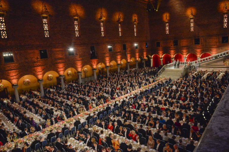 noble-1-1790962282 General view of the Blue Hall, with the Table of Honour (C), during the 2015 Nobel prize award banquet in Stockholm City Hall December 10, 2015. REUTERS/Jonas Ekstromer/TT News Agency ATTENTION EDITORS - THIS IMAGE WAS PROVIDED BY A THIRD PARTY. FOR EDITORIAL USE ONLY. NOT FOR SALE FOR MARKETING OR ADVERTISING CAMPAIGNS. THIS PICTURE IS DISTRIBUTED EXACTLY AS RECEIVED BY REUTERS, AS A SERVICE TO CLIENTS. SWEDEN OUT. NO COMMERCIAL OR EDITORIAL SALES IN SWEDEN. NO COMMERCIAL SALES. TPX IMAGES OF THE DAY