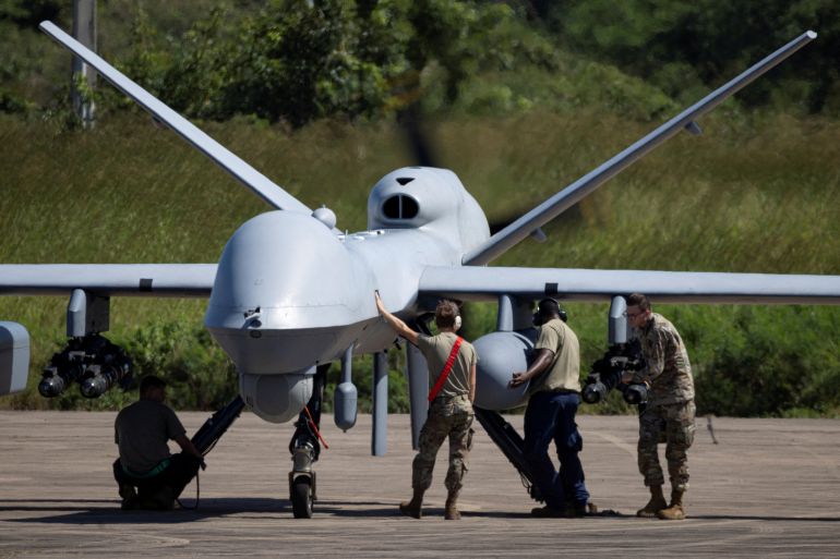 pic-56463-1763566980 A U.S. Air Force MQ-9 Reaper is inspected by ground crew at Rafael Hernandez Airport in Aguadilla, Puerto Rico, November 17, 2025. REUTERS/Ricardo Arduengo TPX IMAGES OF THE DAY