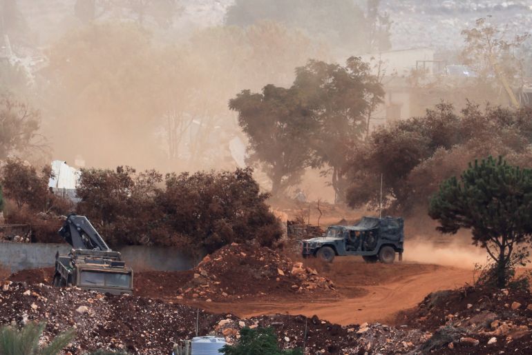 reuters-88774426-1791479468 زوطر An Israeli army vehicle operates in East Zawtar, as seen from West Zawtar, southern Lebanon, October 1, 2026. REUTERS/Mohamed Azakir