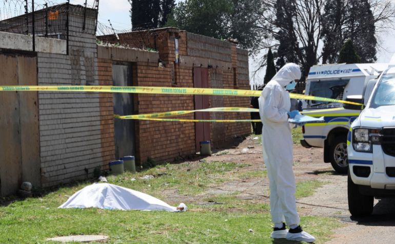 reuters_6abde186-1790828934 A forensic investigator works near a cordoned-off crime scene where the body of one of seven women killed was found in Ekurhuleni, east of Johannesburg, South Africa, September 15, 2026. South African President Cyril Ramaphosa vowed that "no stone will be left unturned" in the investigation into the killings. REUTERS/Stringer