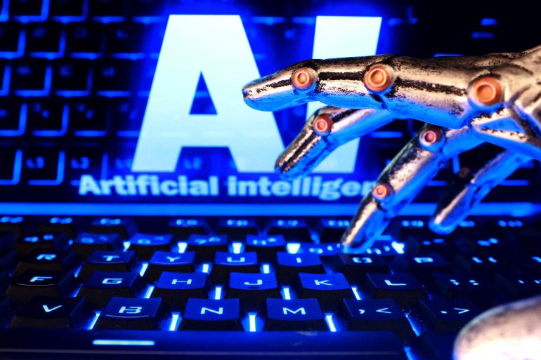 reuters_6adb520d-1792758285 FILE PHOTO: The words "AI Artificial Intelligence", a keyboard, and a robotics hand in this illustration taken October 19, 2026. REUTERS/Dado Ruvic/Illustration/File Photo