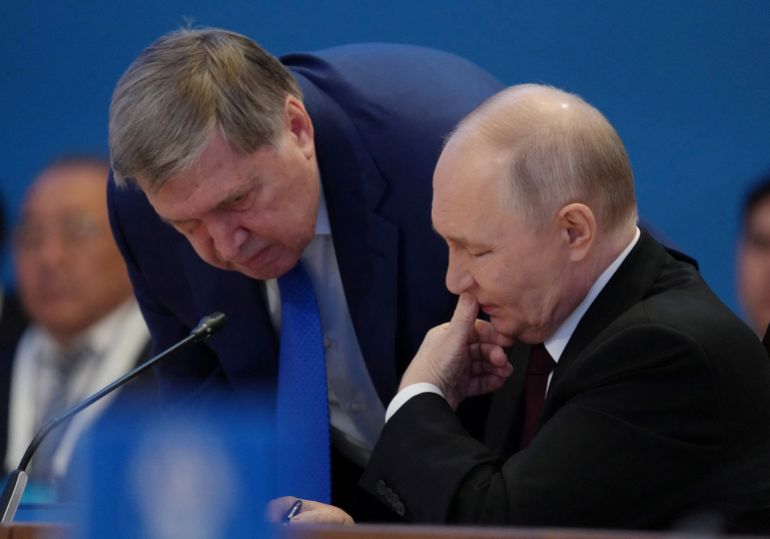 reuters_6ae2da88-1793251976 FILE PHOTO: Russian President Vladimir Putin speaks to his aide, Yuri Ushakov, during the summit of the Supreme Eurasian Economic Council in Astana, Kazakhstan, May 29, 2026. REUTERS/Turar Kazangapov/File Photo