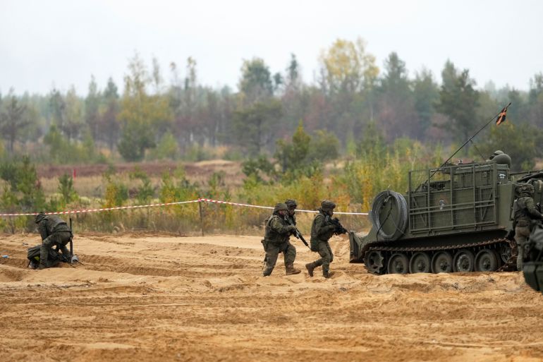 rusnato-1-1790972568 Spanish army servicemen of NATO enhanced Forward Presence battle group take part in the the final phase of the Silver Arrow 2022 military drill on Adazi military training grounds, Latvia September 29, 2022. REUTERS/Ints Kalnins