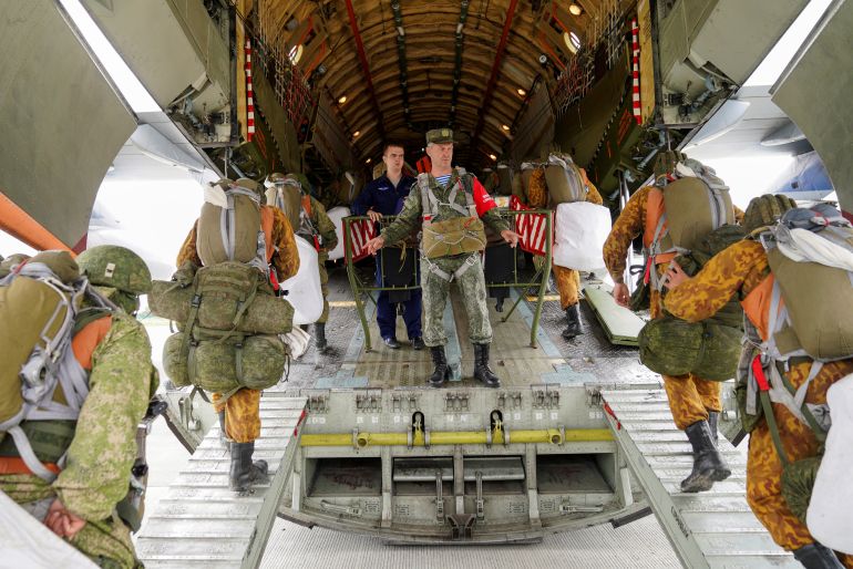 rusnato-3-1790972596 Russian paratroopers board an Ilyushin Il-76 transport plane as they take part in the military exercises "Zapad-2021" staged by the armed forces of Russia and Belarus at an aerodrome in Kaliningrad Region, Russia, September 13, 2021. REUTERS/Vitaly Nevar