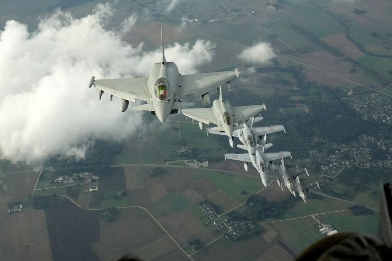 rusnato-6-1790972635 Italian Air Force Eurofighter, Spanish Air Force F-18 and Turkish Air Force F-16 fighter jets fly over Lithuania during a NATO media tour in Siauliai Air Base, Lithuania, September 30, 2026. REUTERS/Ints Kalnins